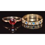 Two 9ct gold rings, one set with a round cut garnet and the other with synthetic spinel, 3.4g,