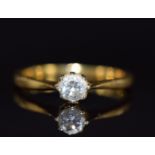 An 18ct gold ring set with a round cut diamond of approximately 0.25ct, 2.6g, size K