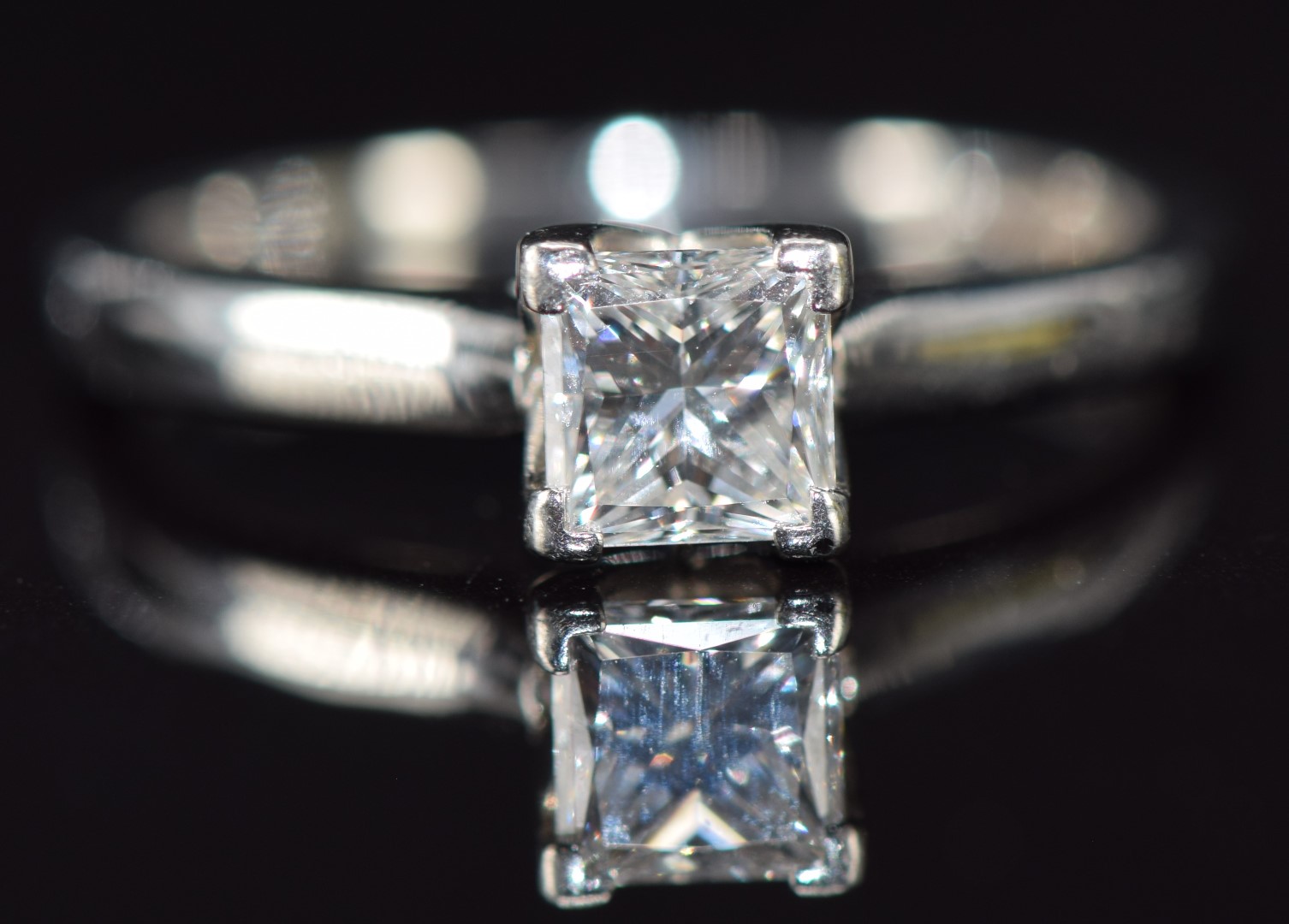 A platinum ring set with a princess cut diamond of approximately 0.5ct, 3.6g, size I/J