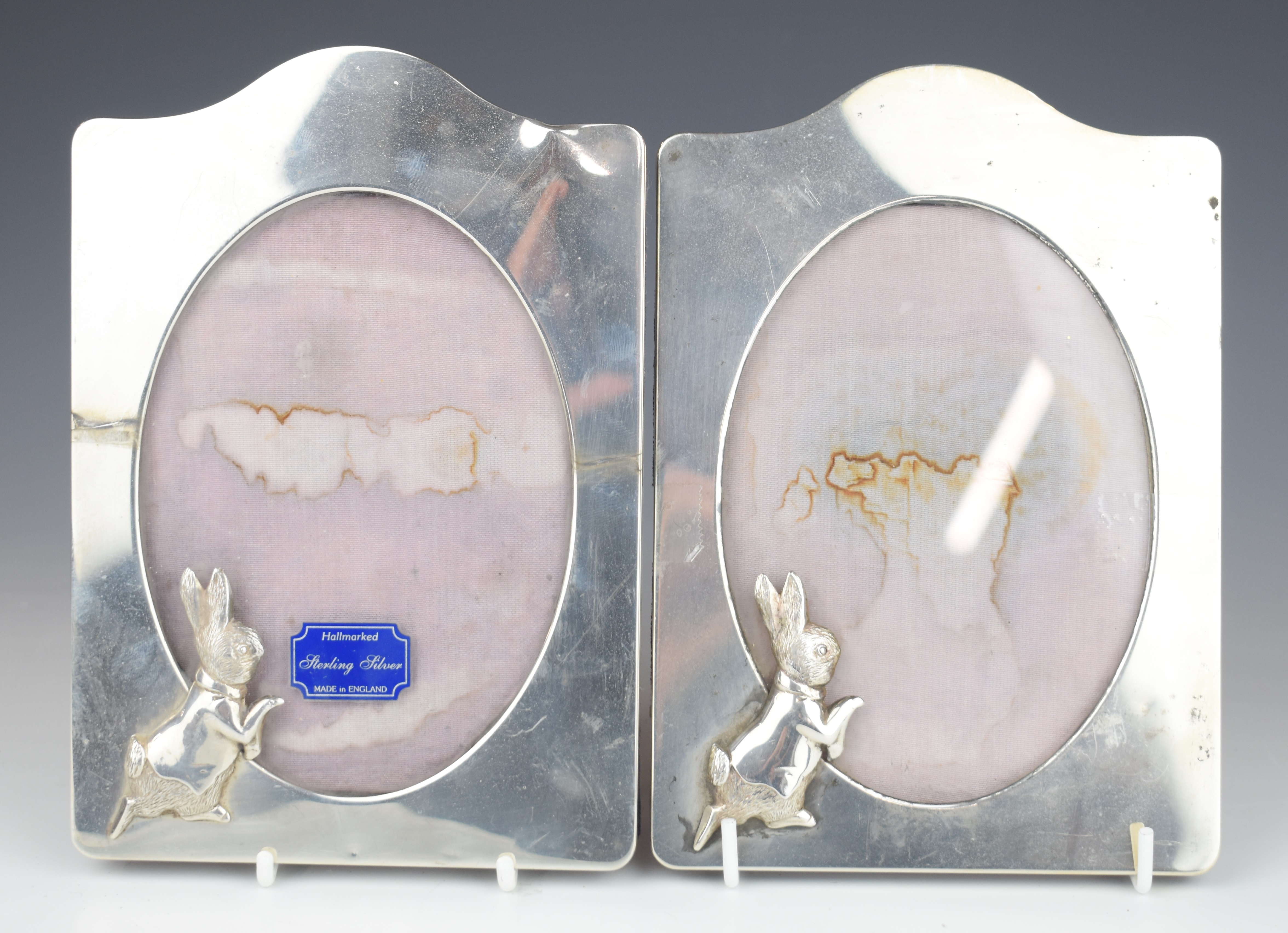 Pair of modern hallmarked silver easel back photograph frames decorated with Peter Rabbit, London