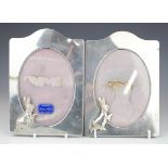 Pair of modern hallmarked silver easel back photograph frames decorated with Peter Rabbit, London