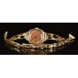 Unnamed 9ct gold ladies wristwatch on 9ct gold expanding bracelet together with a spare 9ct gold