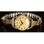 Tissot 9ct gold ladies wristwatch with blued hands, gold Arabic numerals, silver dial and signed