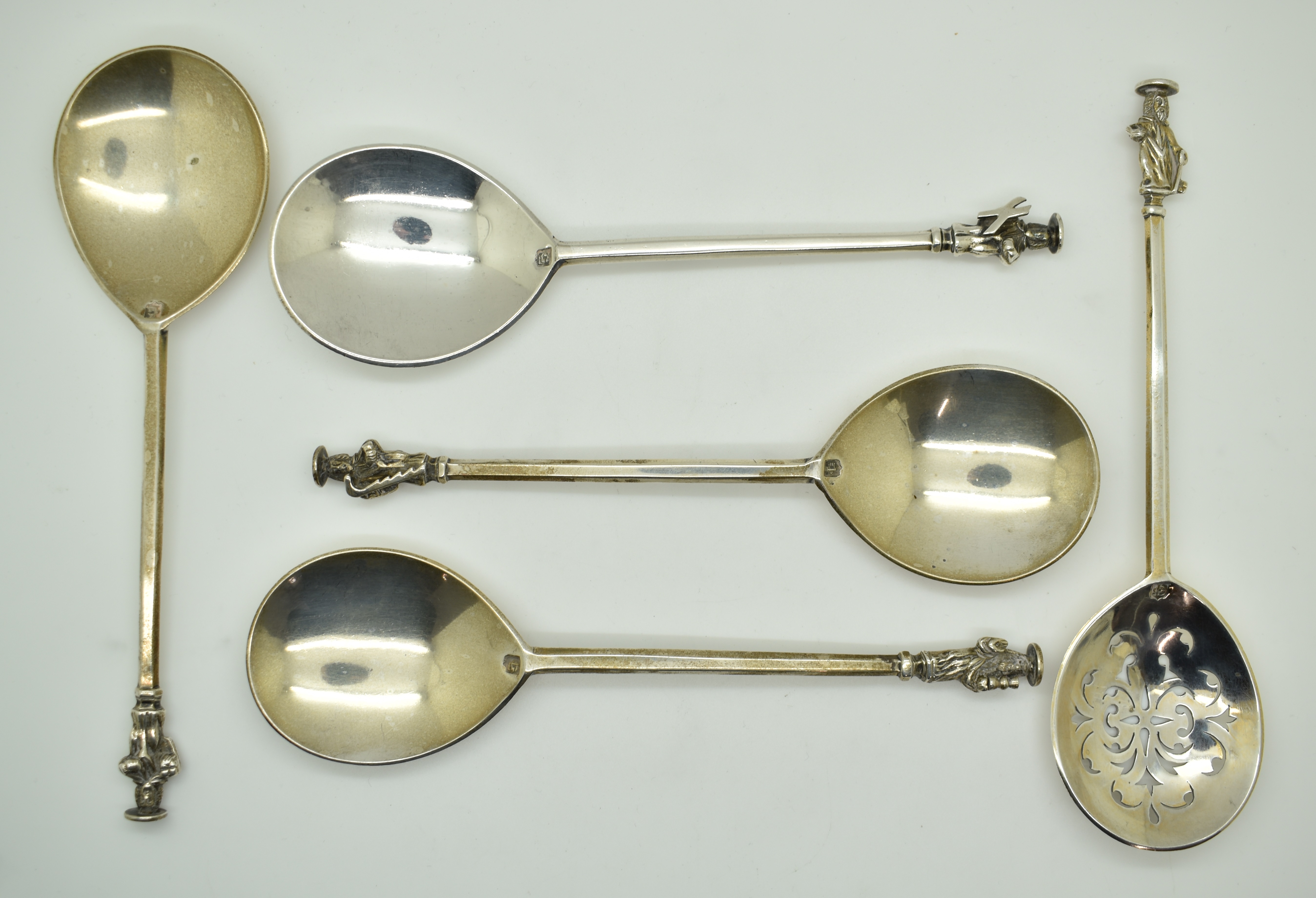 Five Victorian hallmarked silver apostle spoons including a sifter example, three London 1900, one