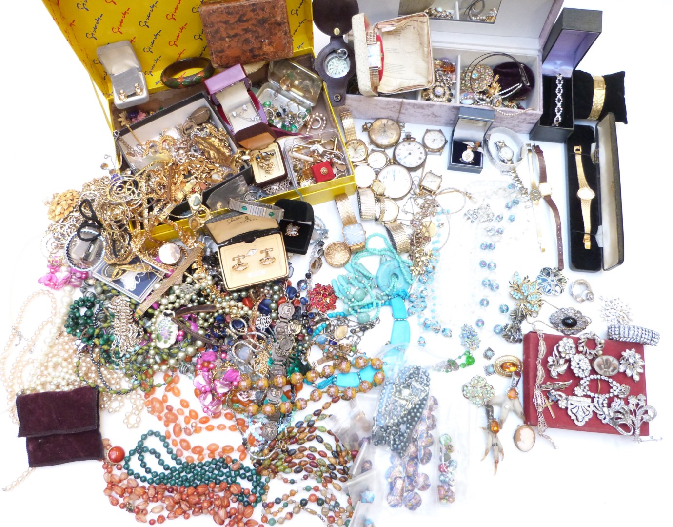 A large collection of costume jewellery including agate beads, vintage brooches, vintage earrings,