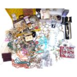 A large collection of costume jewellery including agate beads, vintage brooches, vintage earrings,