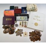 A collection of UK pennies in an album, together with coin sets and loose copper examples, a