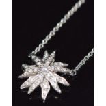 Tiffany & Co platinum necklace set with diamonds in a starburst design, on platinum Tiffany & Co