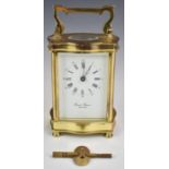 Gilt cased carriage clock by David Peterson with French movement, height including handle 15.5cm