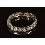 An 18ct white gold eternity ring set with 21 diamonds, each approximately 0.05ct (one diamond