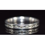 A platinum half eternity ring set with seven diamonds, 3.5g, size M