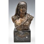 Bronze bust of a semi-clad lady wearing a headdress, on marble base with floral swag, height 35cm