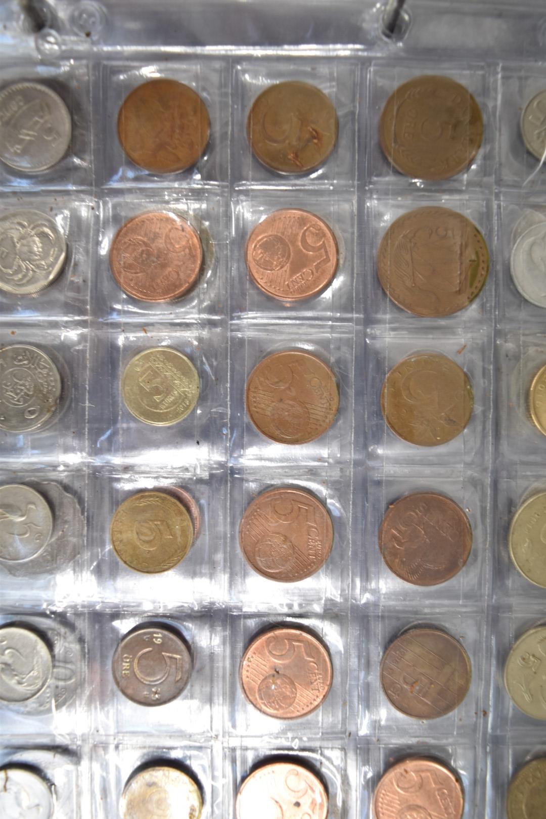 A collection of world coins contained in a Change Checker album - Bild 3 aus 6