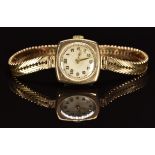 English 9ct gold ladies wristwatch with gold hands and Arabic numerals, silver dial and 15 jewel