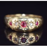 An 18ct gold ring set with rubies and diamonds in star settings, Chester 1918, 4.9g, size V