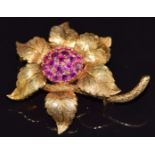 An 18ct gold brooch in the form of a flower and serpent set with Burmese rubies by RHB,16.7g