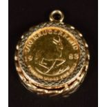 A 9ct gold pendant set with a 1983 1/10 gold Krugerrand, 5.4g