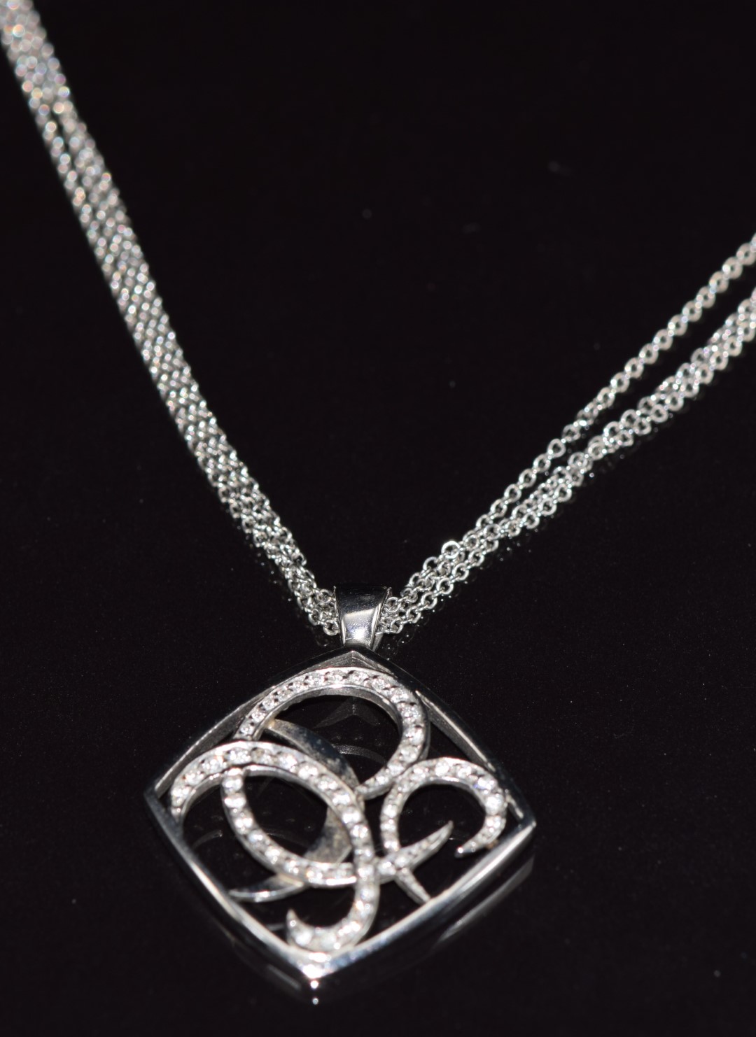 An 18ct gold designer pendant set with 54 diamonds, on triple strand necklace / chain, from the - Image 2 of 3