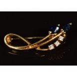 An 18ct gold brooch set with two marquise cut sapphires and diamonds, 3.3g