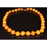 Baltic amber necklace made up of 31 beads, each approximately 15mm, 44g