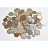 A collection of UK and overseas coinage including Victorian half crown and other silver content,