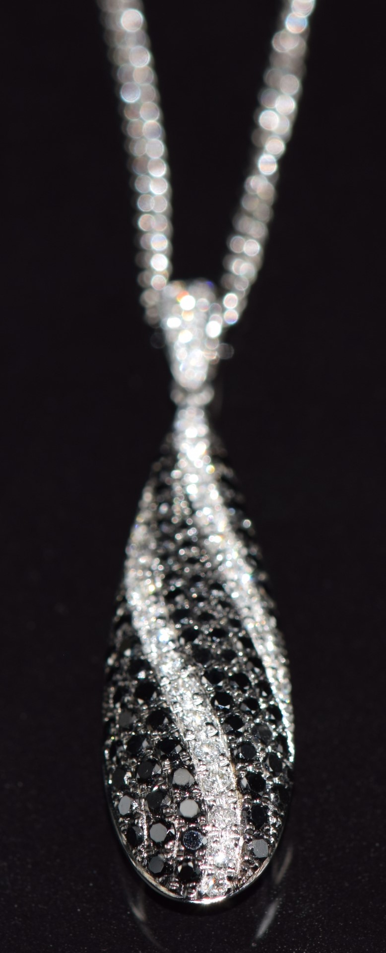 An 18k white gold pendant set with black and white diamonds, total diamond weight 0.92ct, with - Image 3 of 4