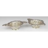 Pair of Victorian hallmarked silver bon bon dishes with embossed and pierced decoration,