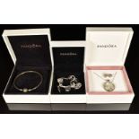 Pandora silver charm bracelet with five silver Pandora charms, a pair of Pandora earrings, Pandora