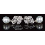 A pair of 18ct white gold earrings set with round and baguette cut diamonds totalling 1.83ct and