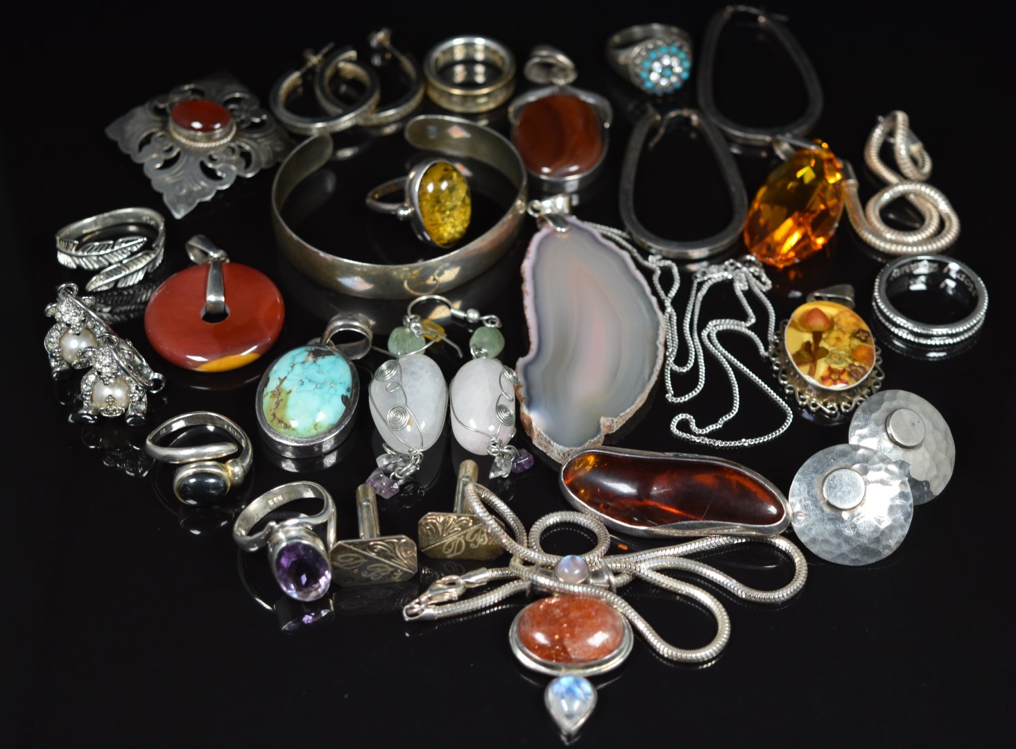 A collection of silver including pendants, bangle, rings, earrings, Vivienne Westwood teddy bear
