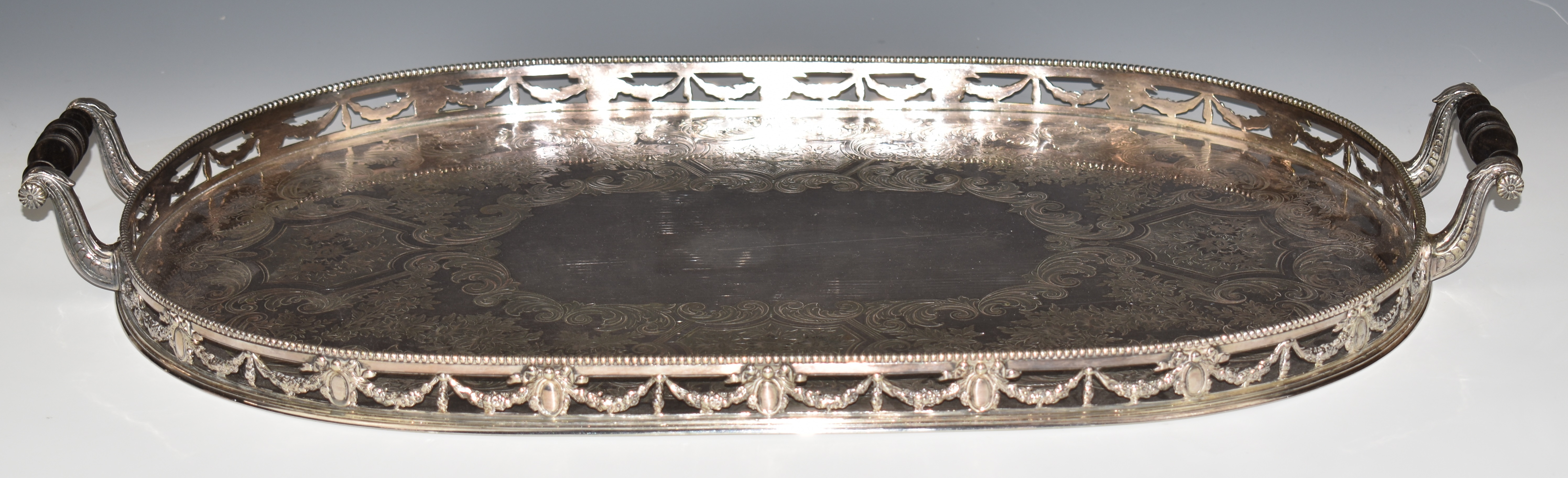 Elkington & Co. silver plated twin handled galleried tray with foliate swag decoration, length 69cm