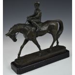 Bronze jockey on horseback, marked to base Coreita, on black marble plinth, length 30cm