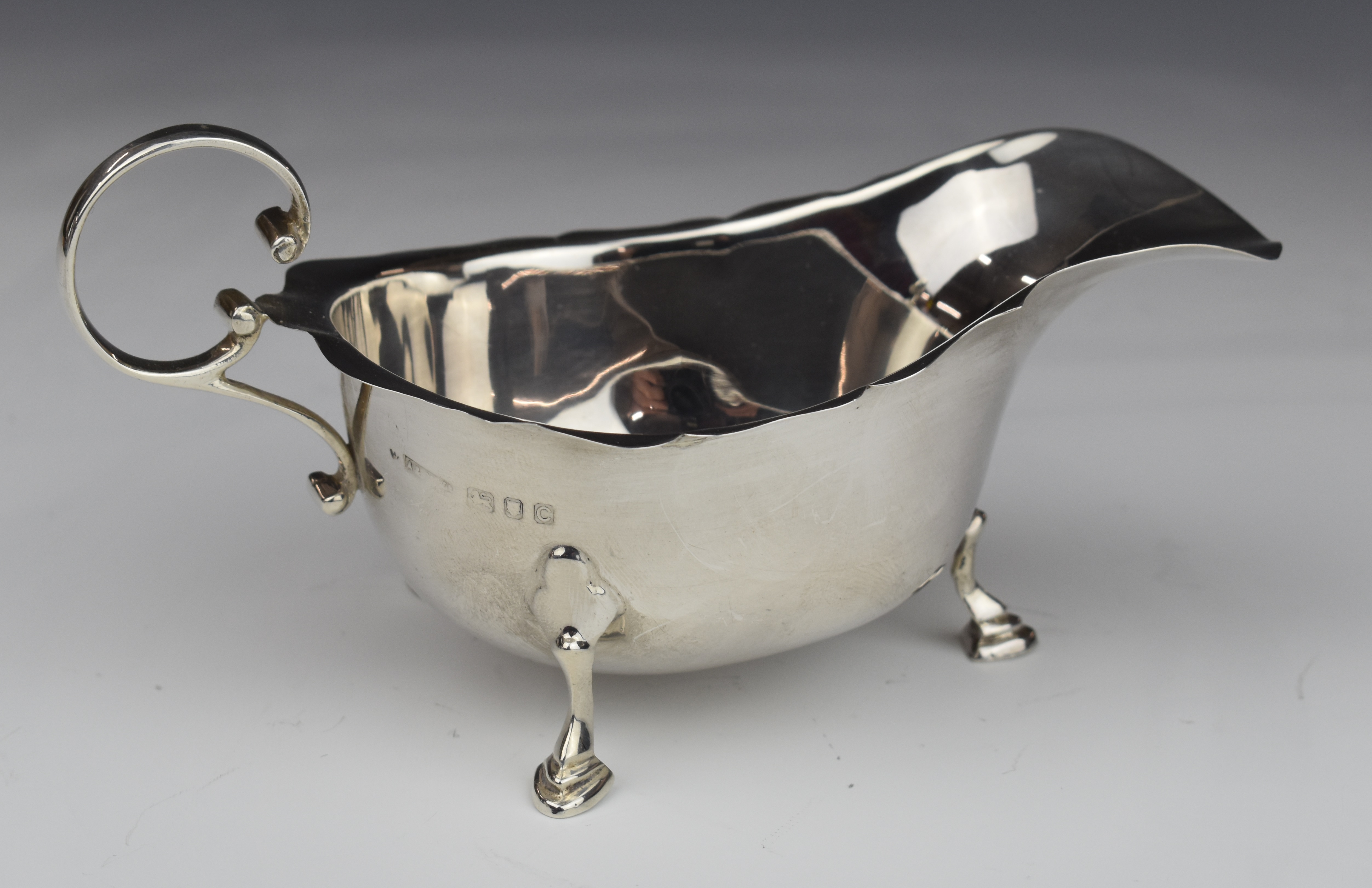 Asprey George VI hallmarked silver sauce boat raised on three feet, London 1938, length 15.5cm, - Image 2 of 5