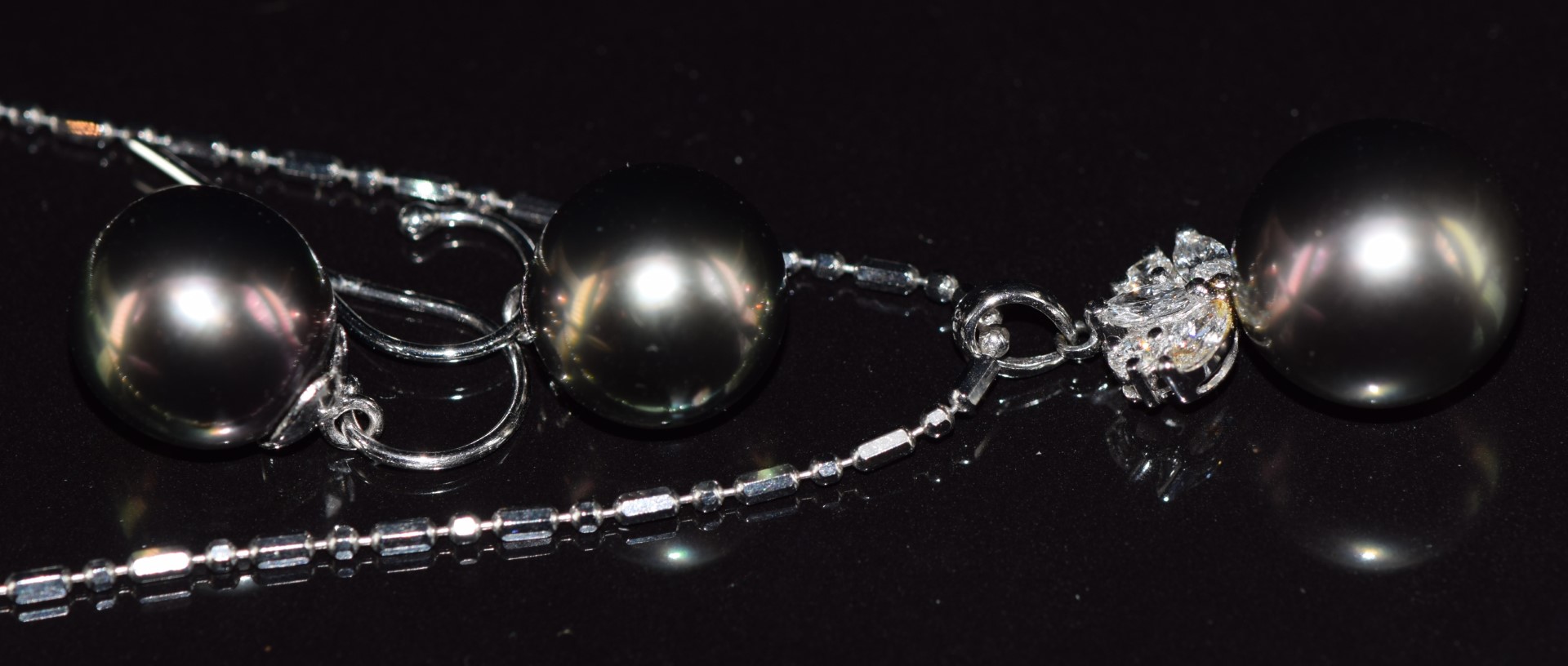 An 18ct white gold pendant set with a 13ct black South Sea pearl, three marquise cut diamonds and - Image 2 of 4
