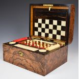 Late 19thC walnut cased games compendium, the domed lid opening to reveal a fitted satinwood