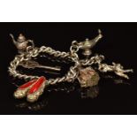 A silver charm bracelet with six silver charms