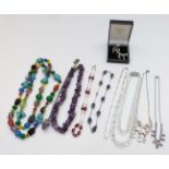 A collection of jewellery including amethyst necklace, silver chain, quartz, silver brooch in the