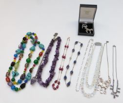 A collection of jewellery including amethyst necklace, silver chain, quartz, silver brooch in the