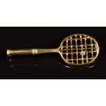 A c1930's 18ct gold brooch in the form of a tennis racquet, set with a transitional cut diamond, 3.