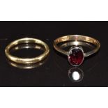 Two 9ct gold rings, one set with an oval cut garnet, 3.7g, size H & M