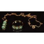 A 9ct gold ring set with diamonds and emeralds in three floral clusters, with matching pendant and
