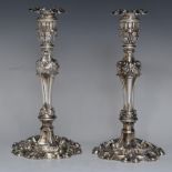 Pair of Georgian cast hallmarked silver candlesticks, with scroll and acanthus leaf decoration,