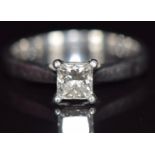 A platinum ring set with a princess cut diamond of 0.6ct, with GIA certificate, 4.7g, size K