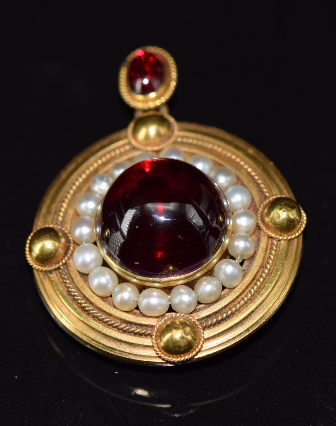Victorian yellow metal pendant / brooch set with two foiled garnet cabochons surrounded by natural - Image 2 of 4