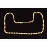 A 14k gold necklace made up of textured and smooth circular beads, 16.8g