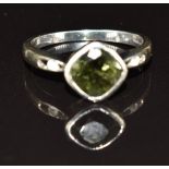 A 9ct white gold ring set with tourmaline and white sapphires, 3.0g, size N