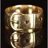 A 9ct gold buckle ring set with garnets, 4.8g, size S