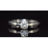 A platinum ring set with a 0.41ct round brilliant cut diamond, with GIA certificate stating VS2 / F