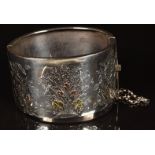 Aesthetic period silver bangle with applied gold floral decoration