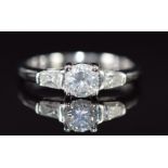 An 18k white gold ring set with three diamonds, total diamond weight approximately 0.5ct, 2.6g, size